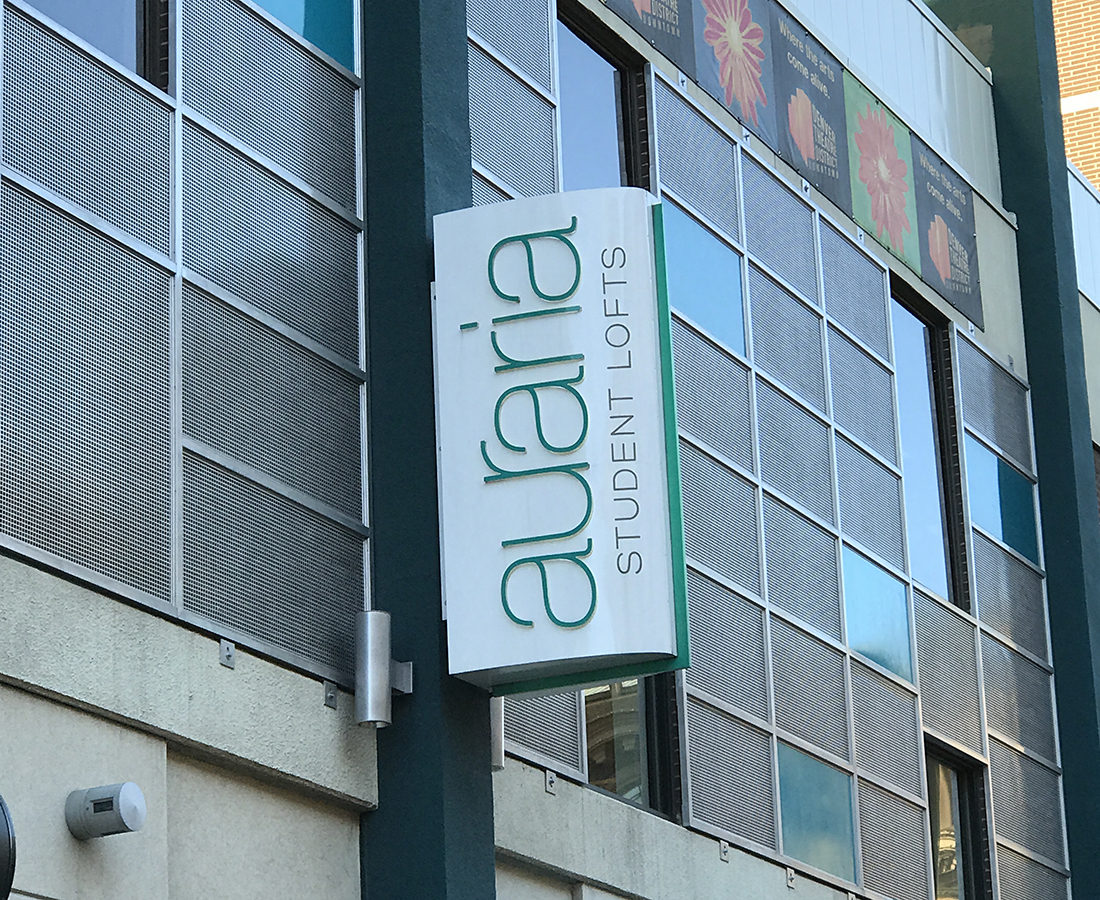 Auraria Student Lofts blade sign day time exterior sign