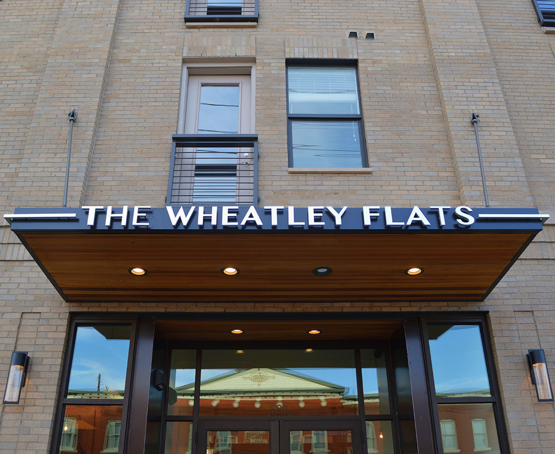 The Wheatley Flats entry canopy sign