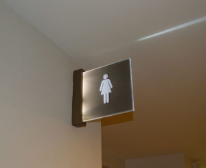 Union Station interior illuminated blade sign restroom