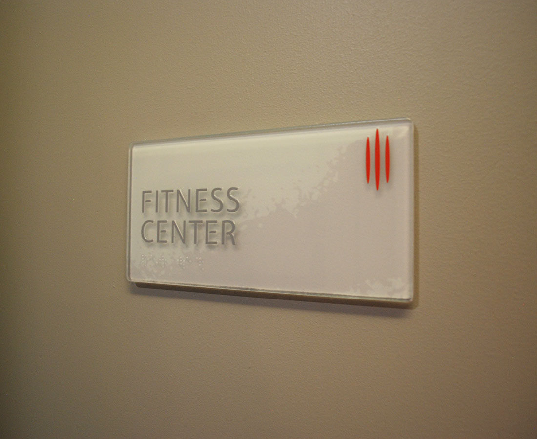 Coda Apartments Glass ADA Room Sign Fitness Center