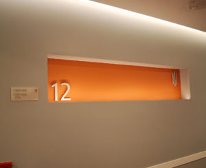 Coda Apartments Floor Identification sign orange