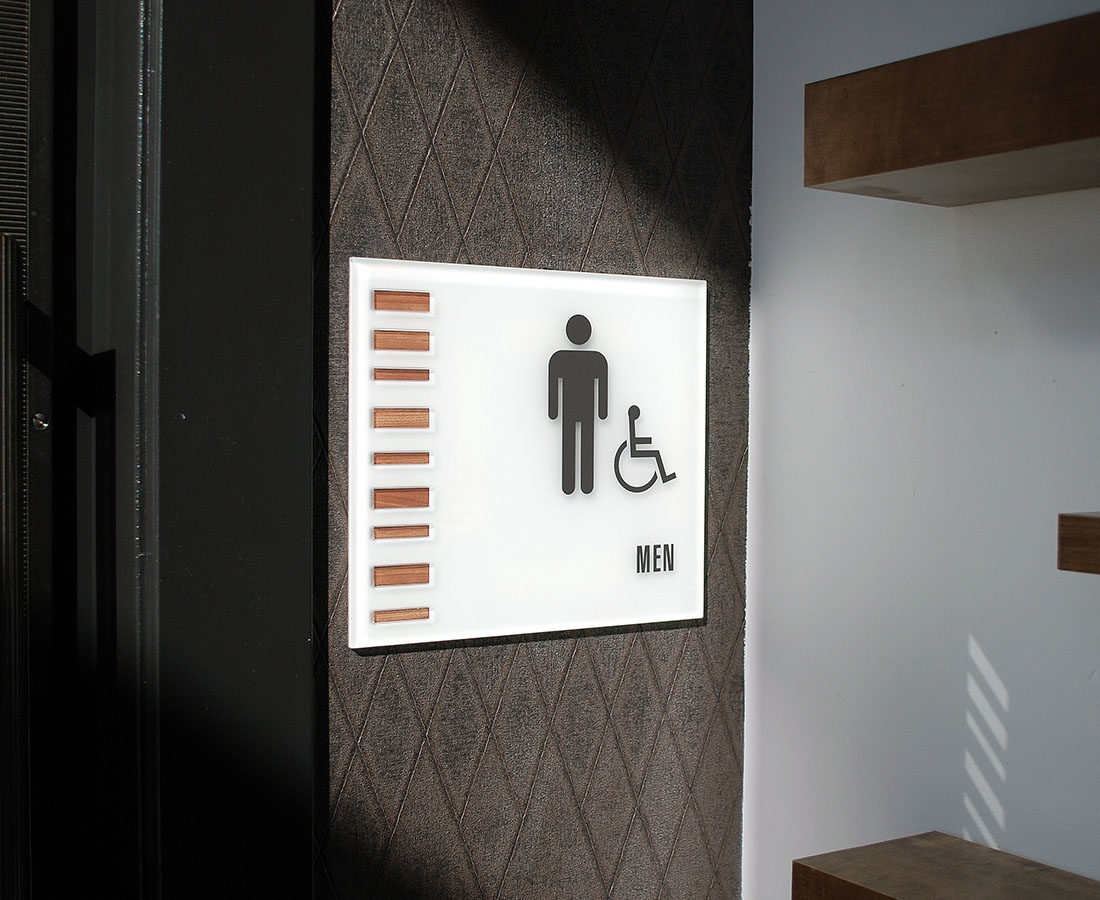 Solana Lucent Station glass restroom ID sign