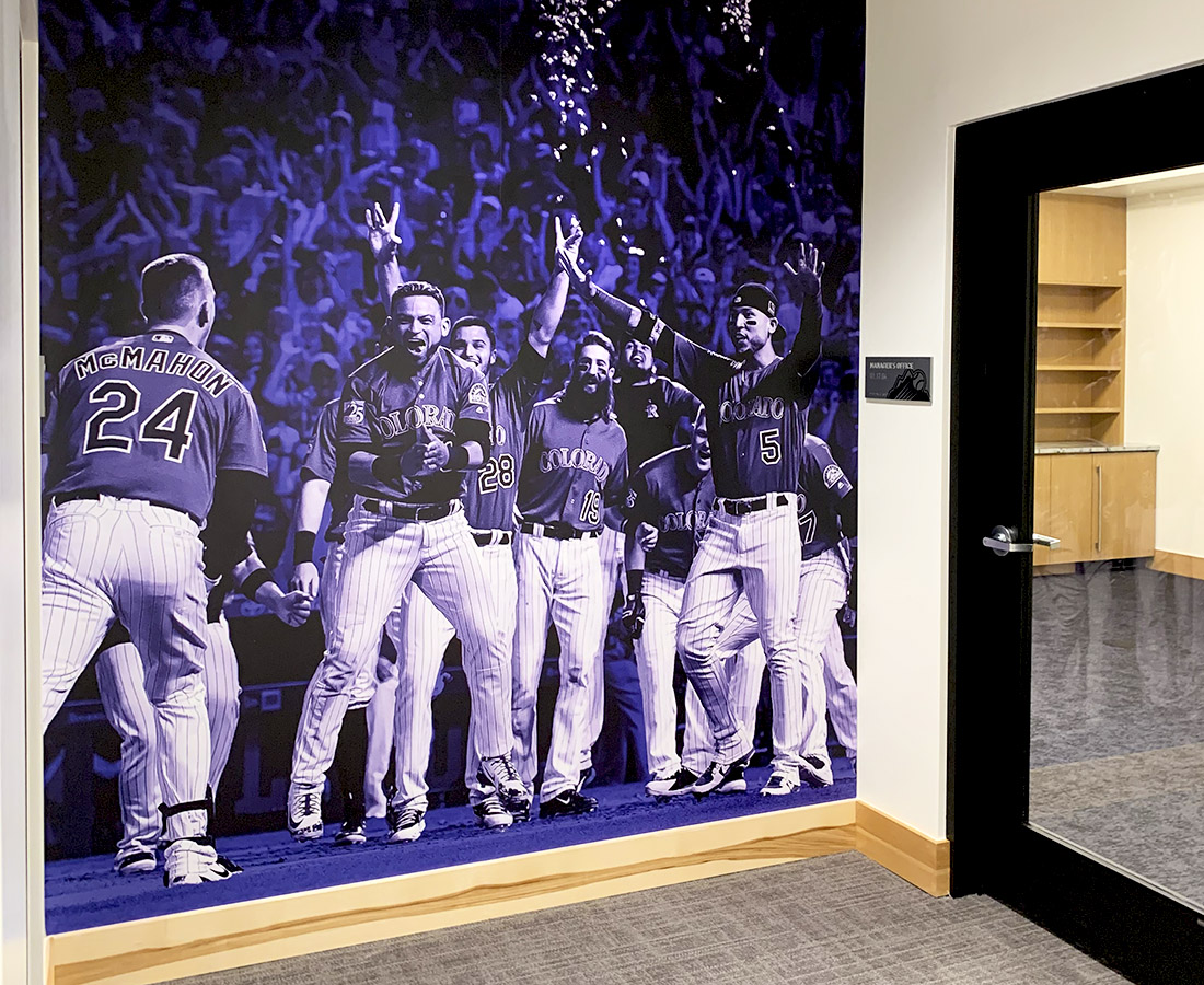 Purple Rockies player wall graphic at the Colorado Rockies Clubhouse at Coors Field