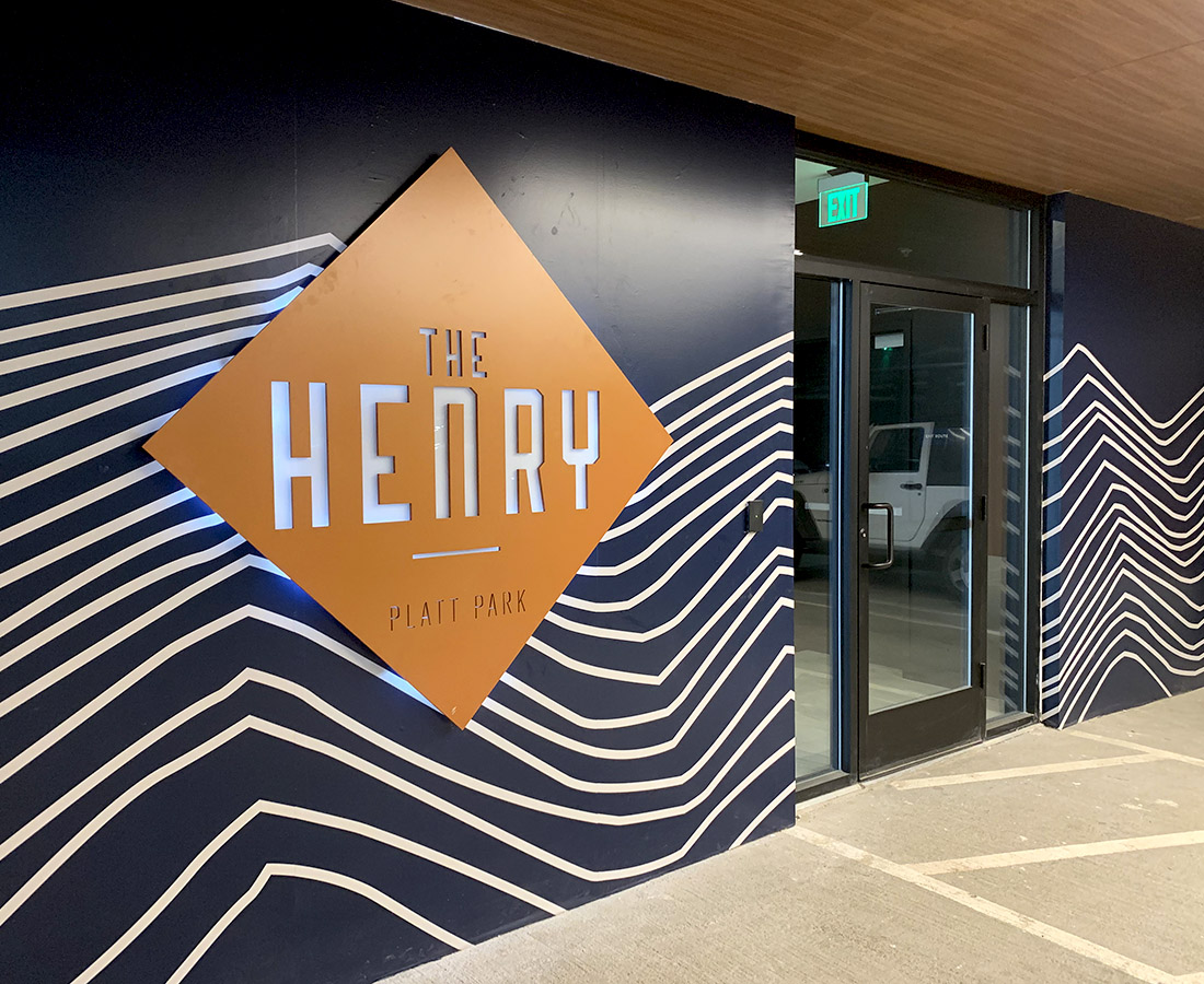 The Henry illuminated parking garage sign