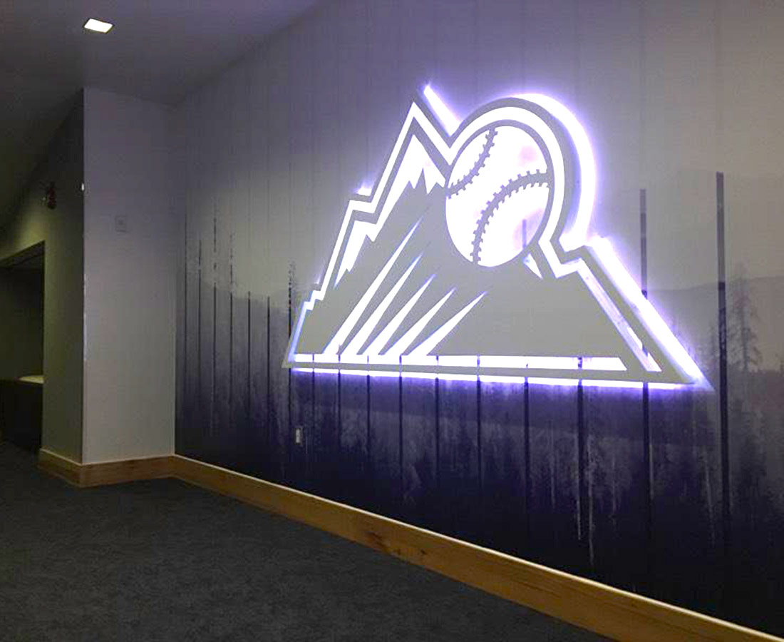 Illuminated graphic wall Rockies logo at the Colorado Rockies Clubhouse at Coors Field