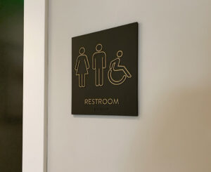 Interior restroom sign at the Fremont Residences