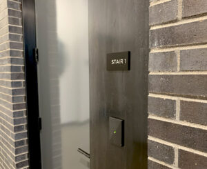 Interior ADA compliant Stair room ID sign at Modera LoHi