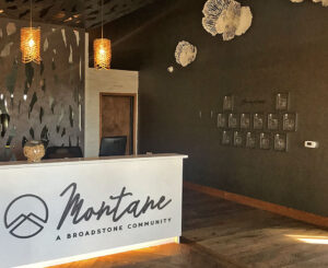 Interior leasing desk signage at Alliance Residential Montane