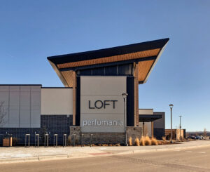 Exterior signs at Denver Premium Outlets of tenants Loft and Perfumania