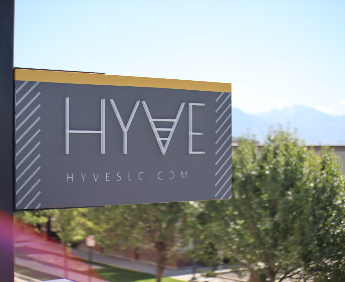 Hyve's blade sign shining brightly under the daytime sun in Salt Lake City.